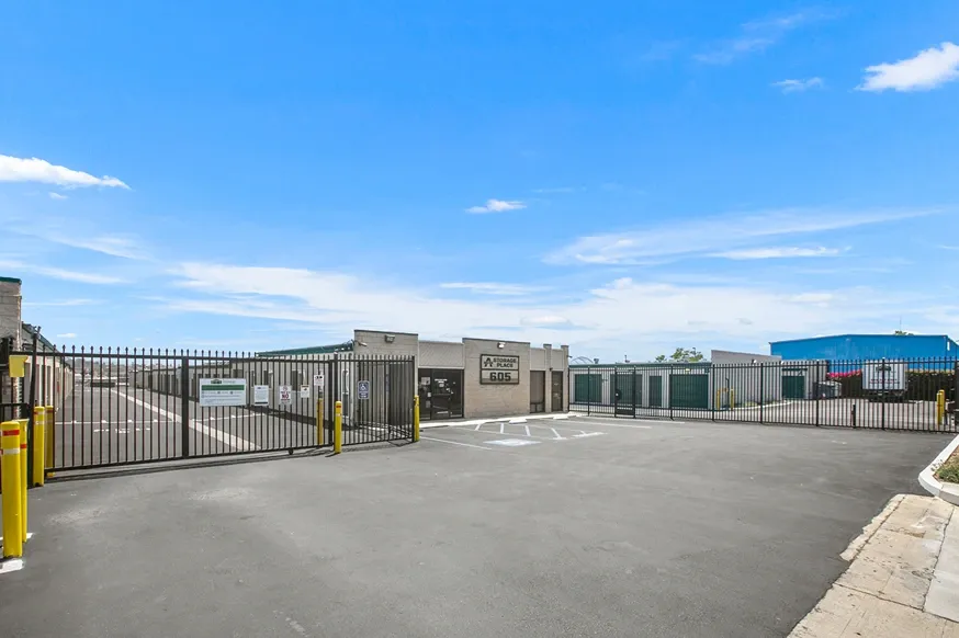 Gated access and front of storage facility building.