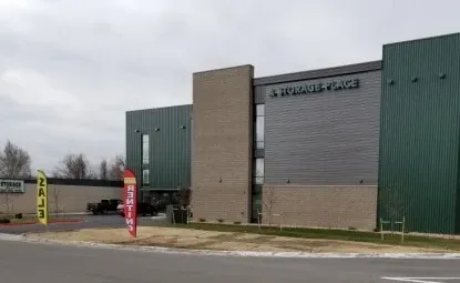 Signs for a sale outside of a storage facility.