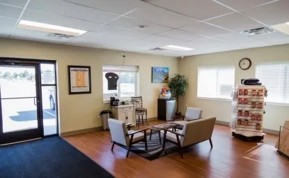 Office with chairs and table at a storage facility.
