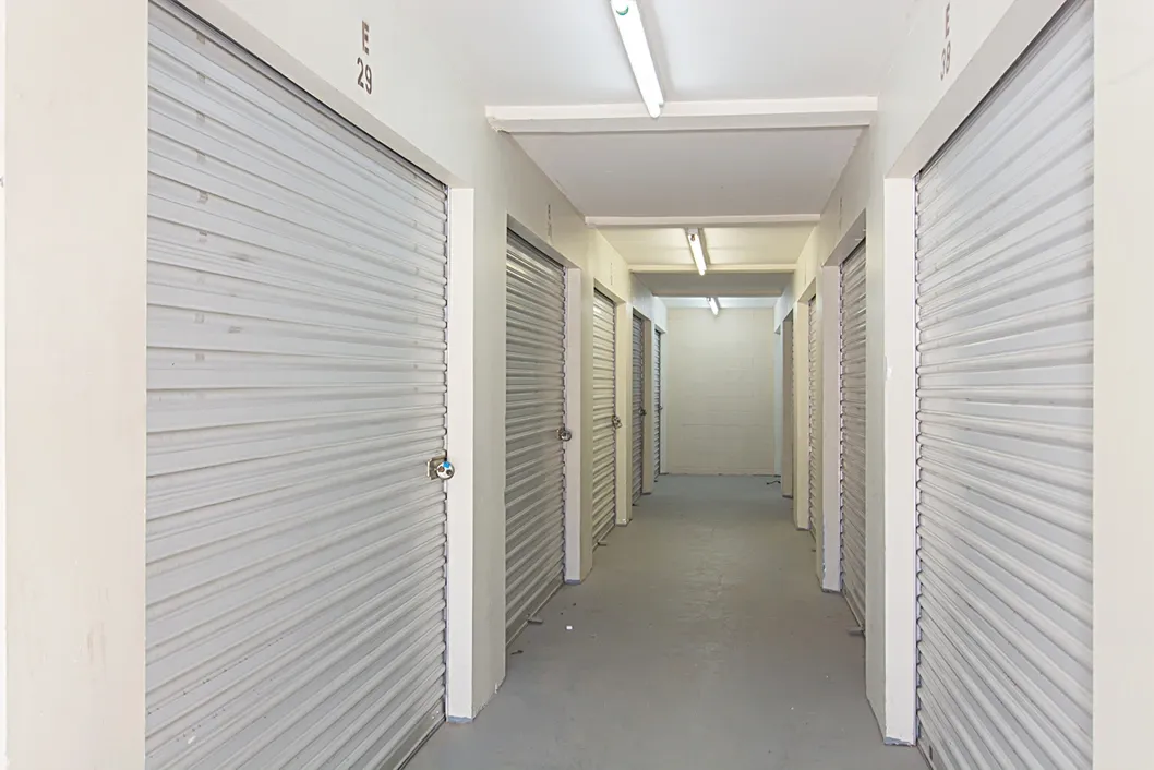 Inner hallway with white indoor storage units.