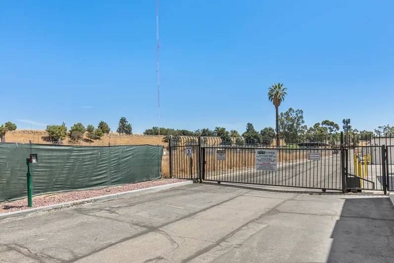 Main storage gate near a yellow field.