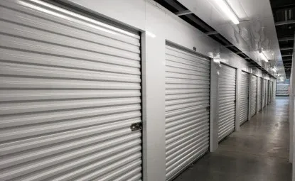 White storage unit doors at an indoor storage facility.
