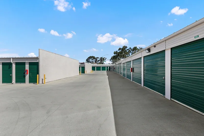 Outdoor storage drive up green storage units.
