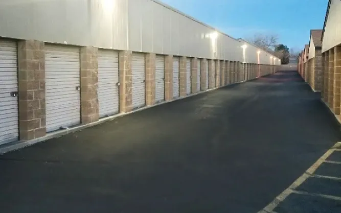Well lit white doored storage units.