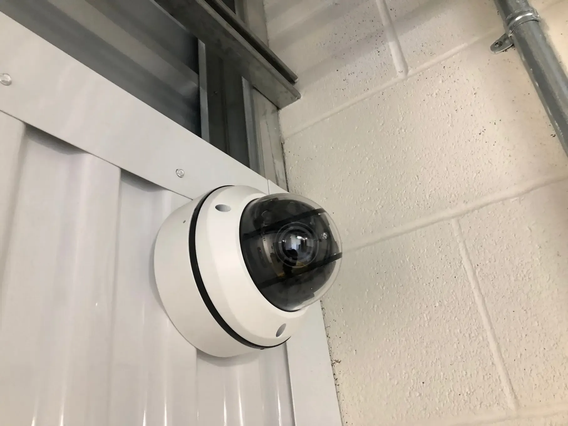 Close up of a security camera at an outdoor storage facility.