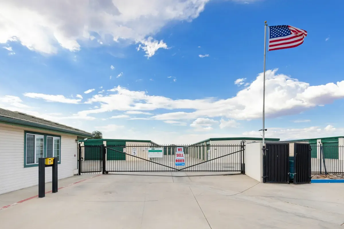 American flag above the main gate of a storage facility.