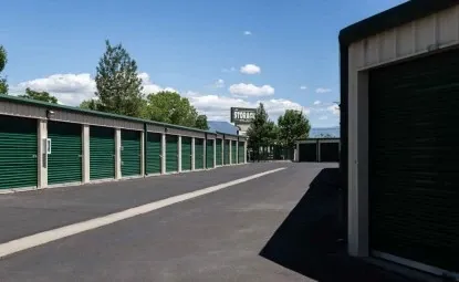 Rows of medium outdoor green storage units.