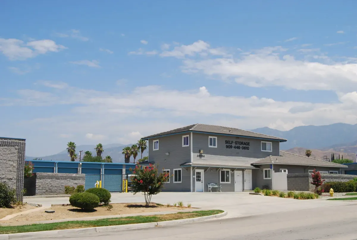 Blue doored storage units and a self storage office.
